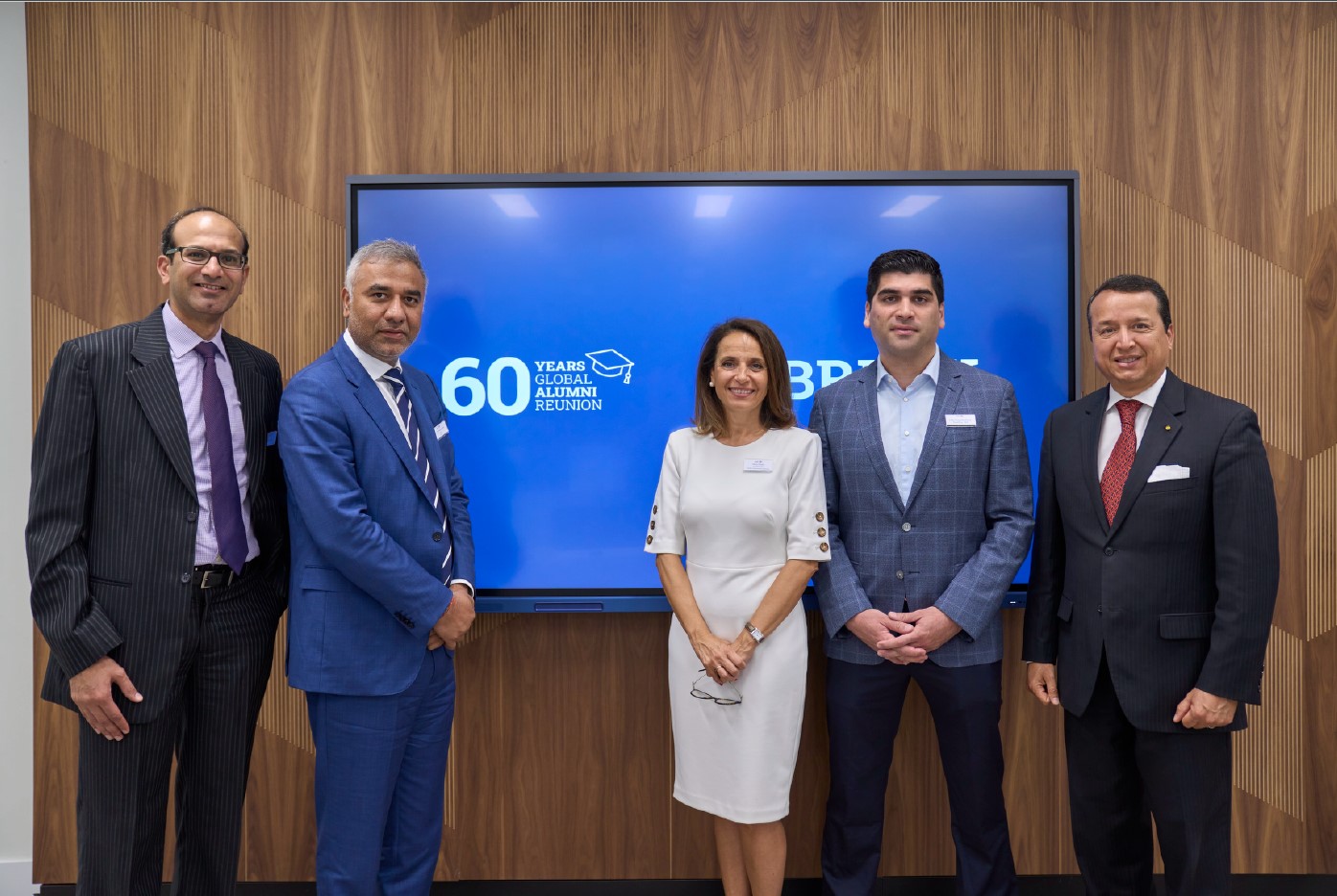 Ankur Mehta, Dr. Rana, Marta Muñiz, Otto Sonnenholzner and Alex Mejia in front of a tv with a blue screen