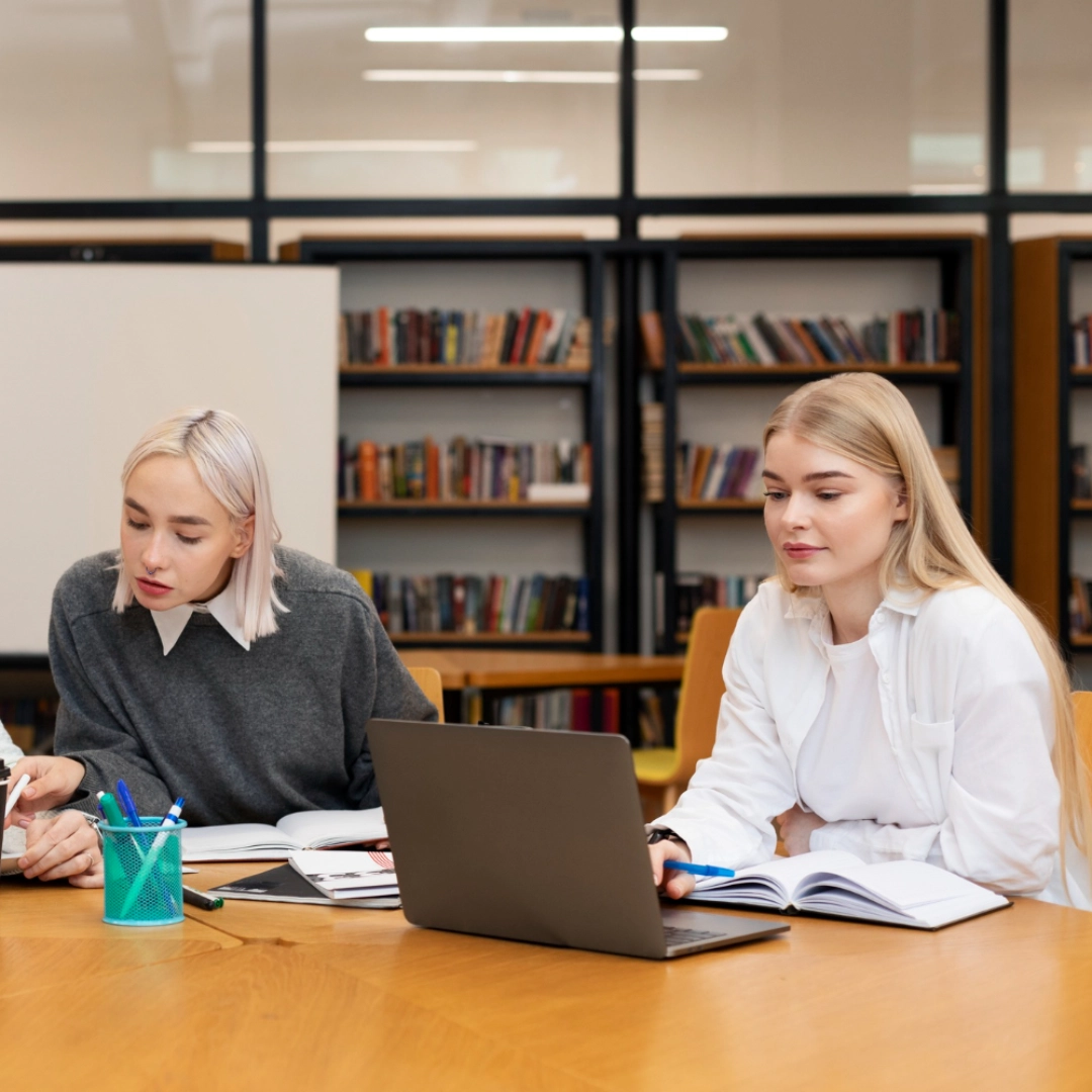 Students collaborating in a Paris university library in an international learning environment